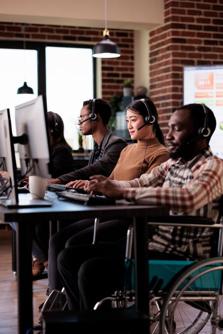 paralyzed-wheelchair-user-working-at-call-center-h-2023-11-27-05-21-00-utc